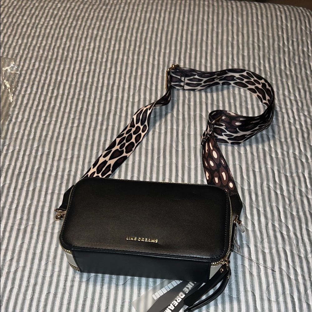 Stylish Black Crossbody Bag with Patterned Strap